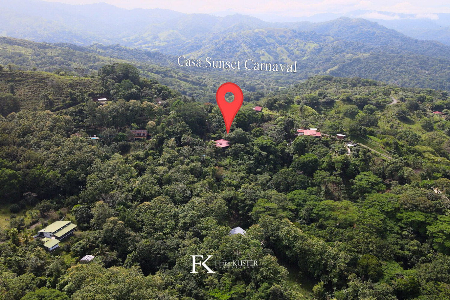 Aerial view marking the home among forested hills