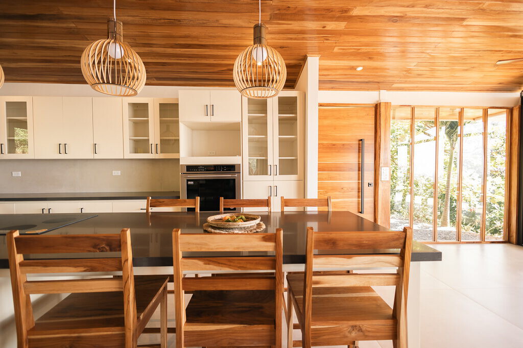 Kitchen and dining space with pendant lighting