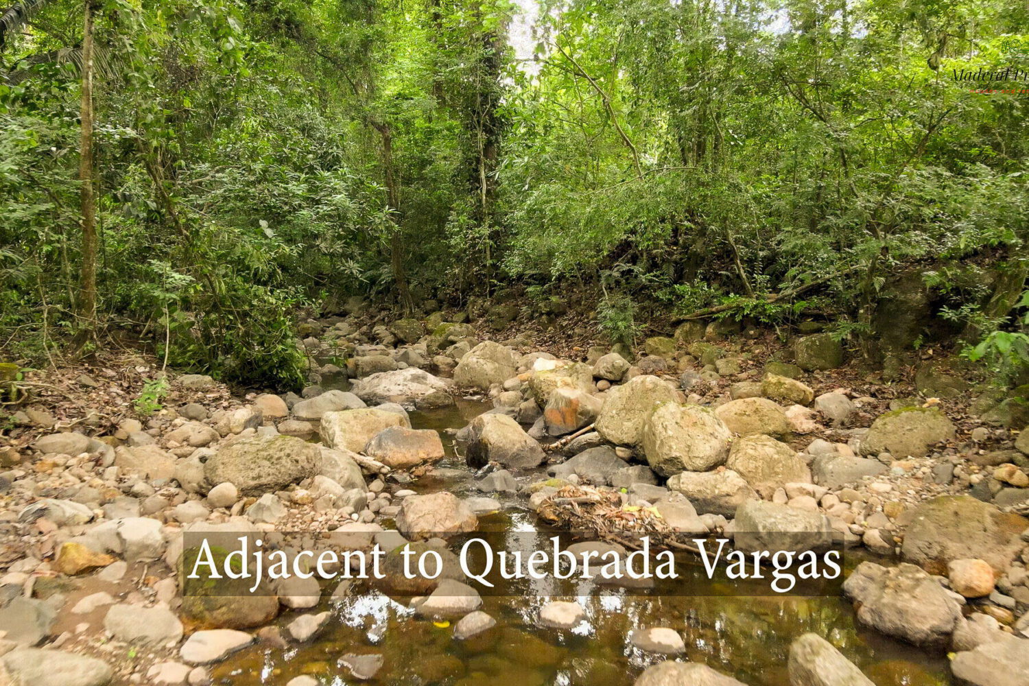 Rocky streambed of the Quebrada Vargas beside the lot