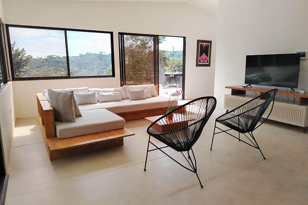 Living area with modern seating facing the valley view