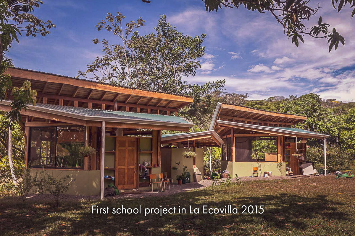 An open timber school building with a wide overhanging roof